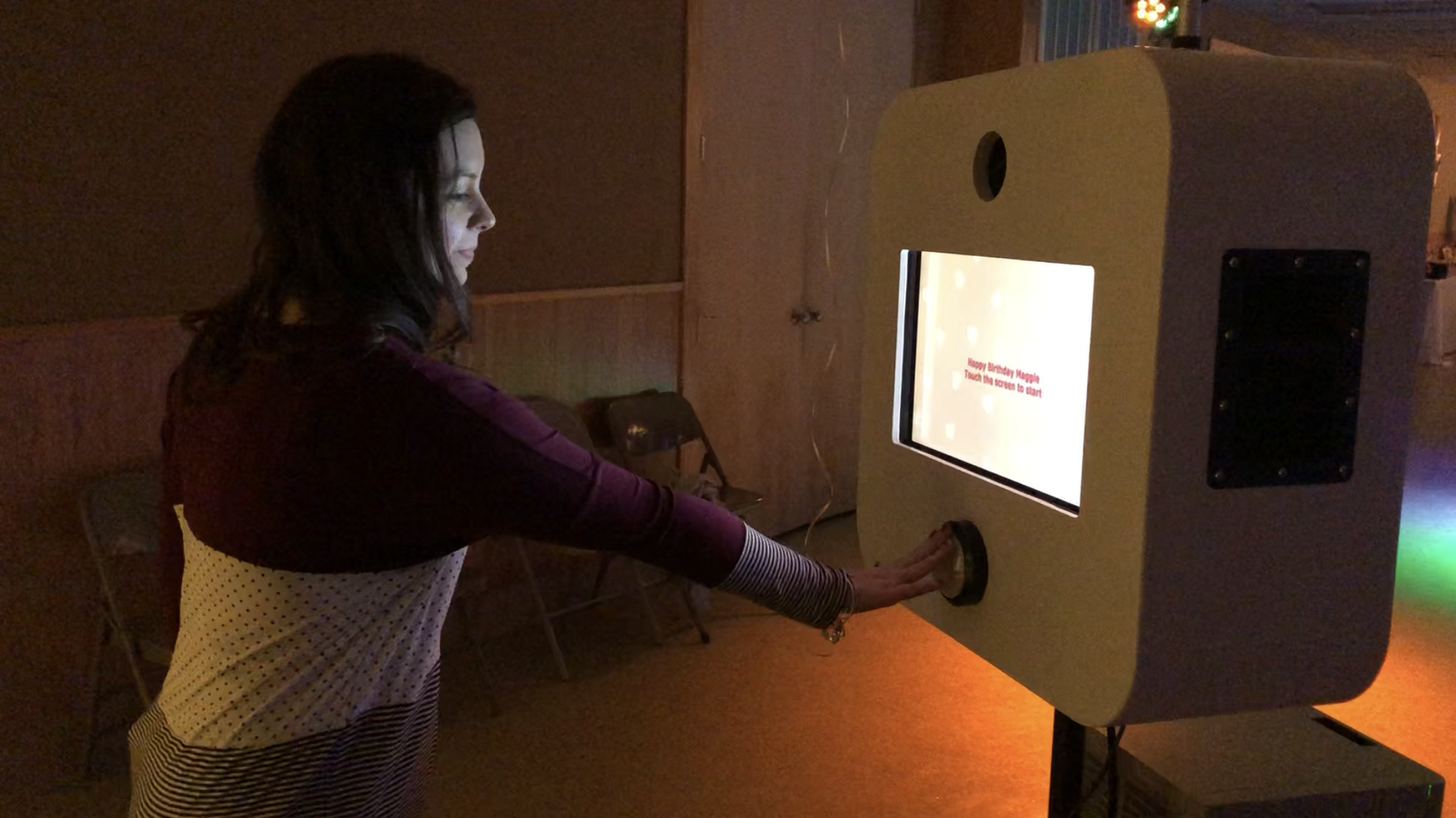 Beautiful Woman Pressing Photo Booth Button